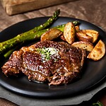 10 Simple Ways to Boost Metabolism and Energize Your Body Steak served with roasted potatoes and asparagus on a black dinner plate.