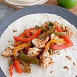 a warm tortilla loaded with low sodium chicken fajitas and tender bell pepper strips