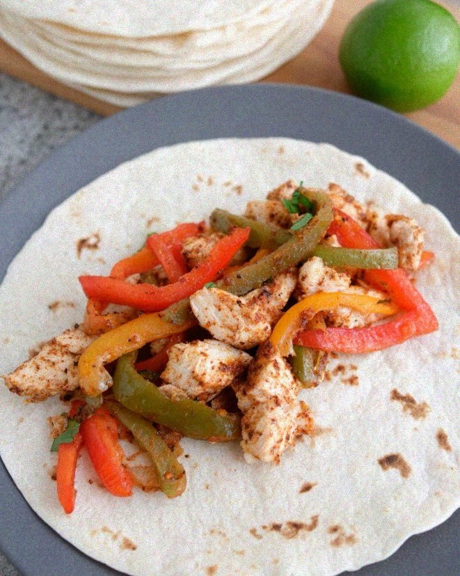 a warm tortilla loaded with low sodium chicken fajitas and tender bell pepper strips